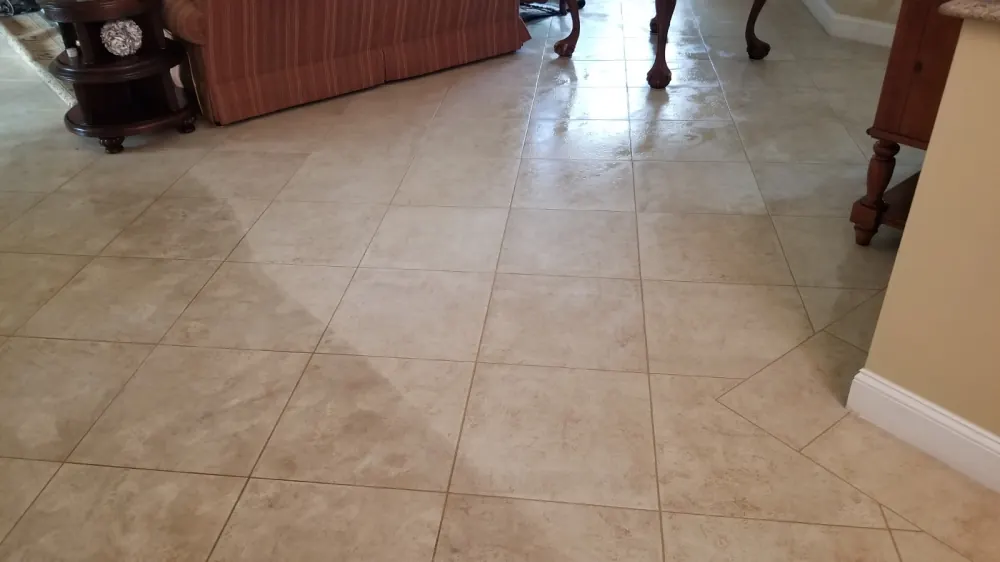 Tile floor cleaned around dining chairs