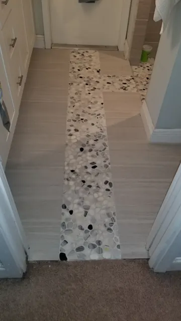 Pebble-stone shower floor after cleaning