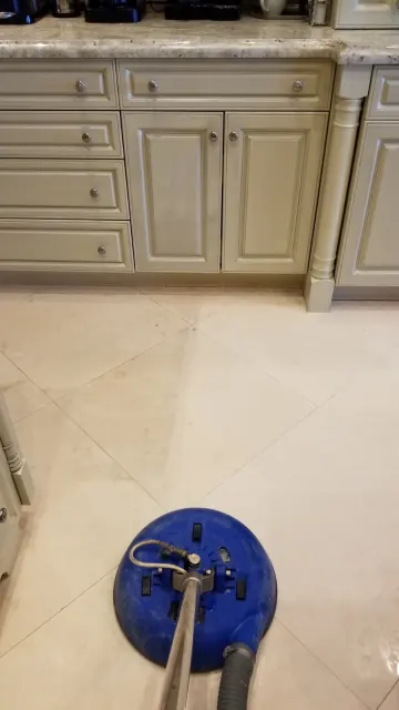 Marble kitchen floor being cleaned